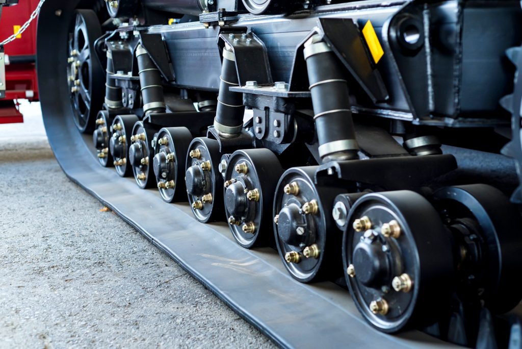 A close up of modern rubber tractor tracks